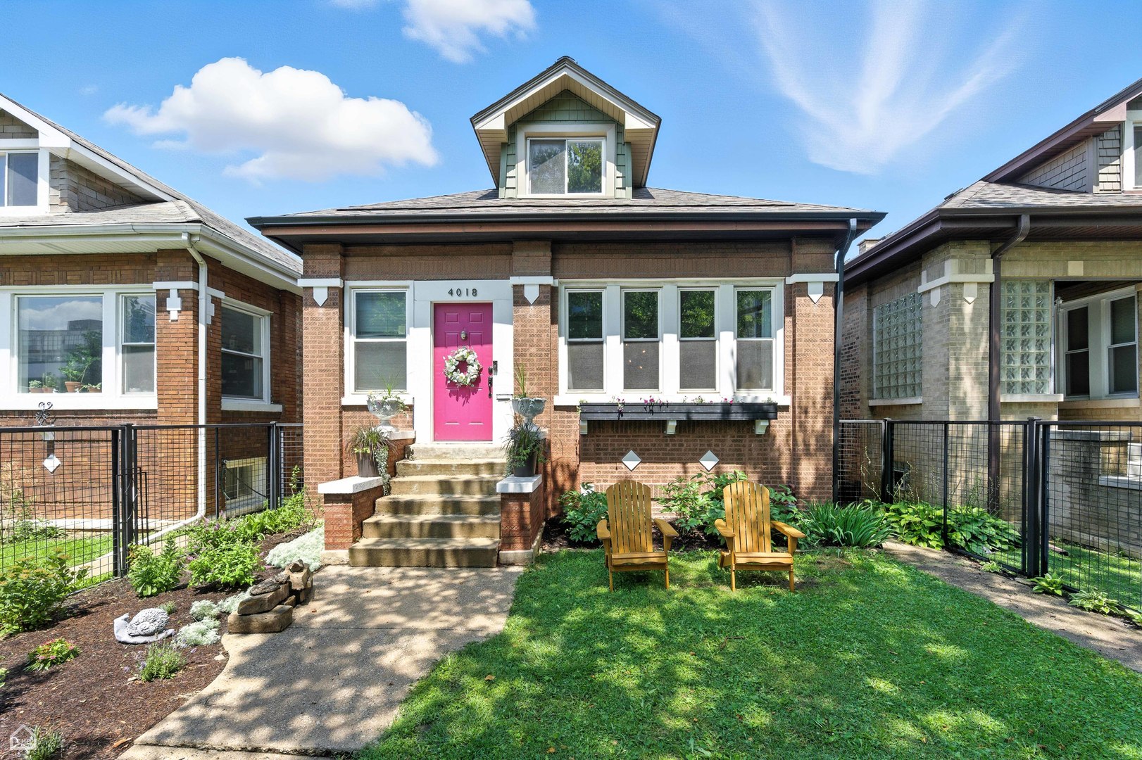 4018 West George Street Chicago, IL 60641 - Photo 1 of 1 a view of a house with many windows and garden