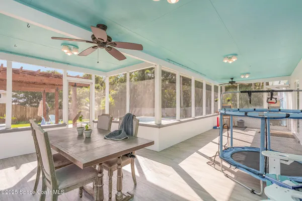 a view of a dining room with furniture window and outside view