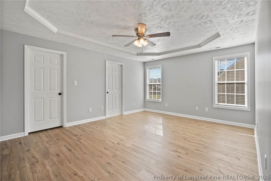 5353 Pringle Way Hope Mills, NC 28348 - Photo 11 of 29 a view of an empty room with wooden floor and a window
