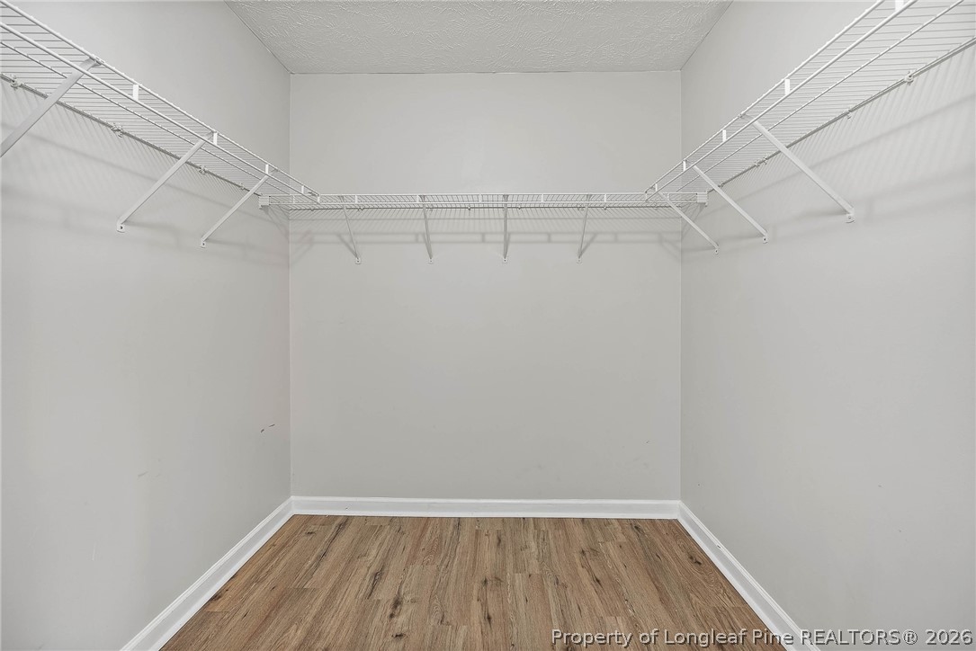 5353 Pringle Way Hope Mills, NC 28348 - Photo 13 of 29 a view of a room with racks on the wall