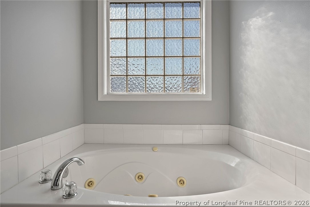 5353 Pringle Way Hope Mills, NC 28348 - Photo 18 of 29 a bathroom with a bathtub