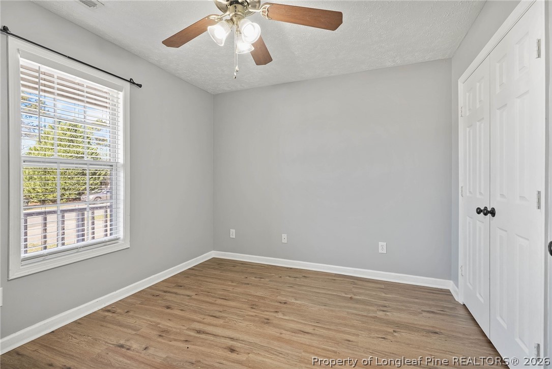 5353 Pringle Way Hope Mills, NC 28348 - Photo 20 of 29 a view of an empty room with wooden floor and a window