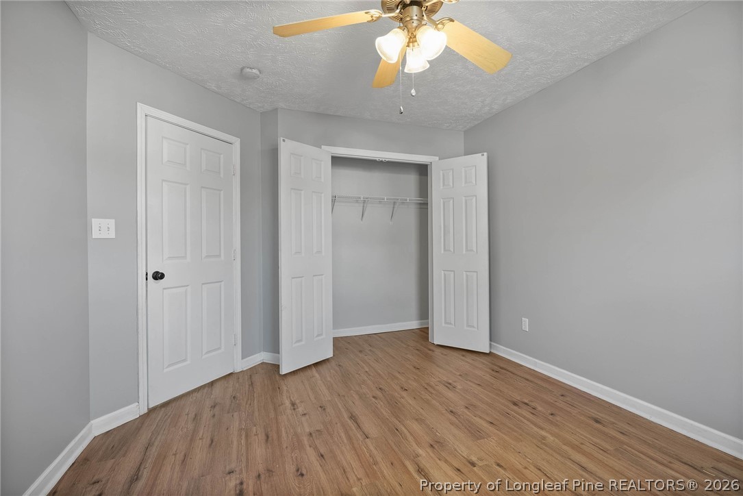 5353 Pringle Way Hope Mills, NC 28348 - Photo 22 of 29 an empty room with wooden floor and windows