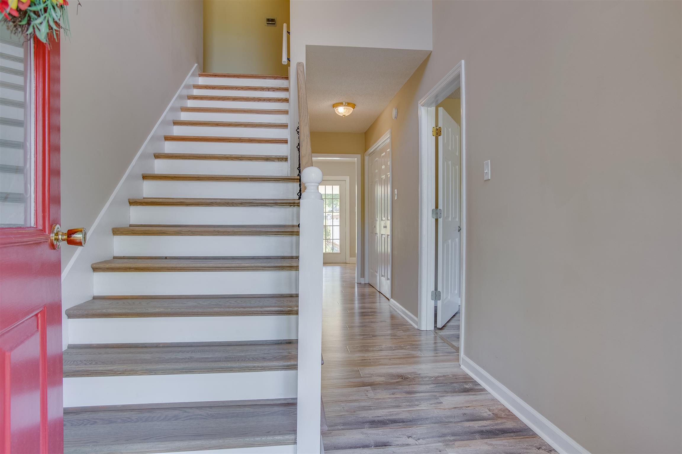 Bright and cheery two story foyer will welcome you and your `guests