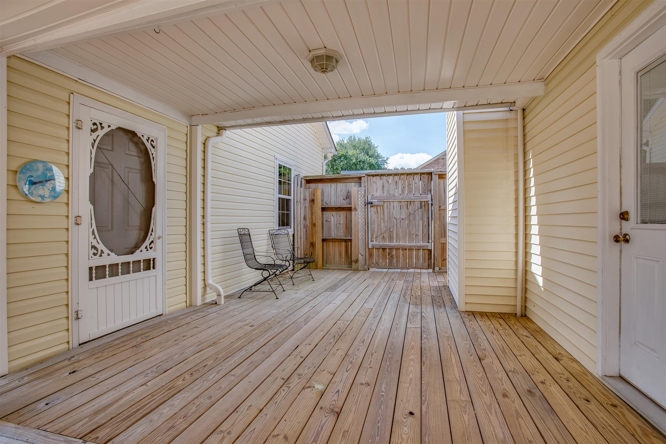 878 Tom Osborne Road Columbia, TN 38401 - Photo 21 of 26 Breeze way between home and garage is the perfect spot to catch a moment of solitude with a cup of coffee each morning.