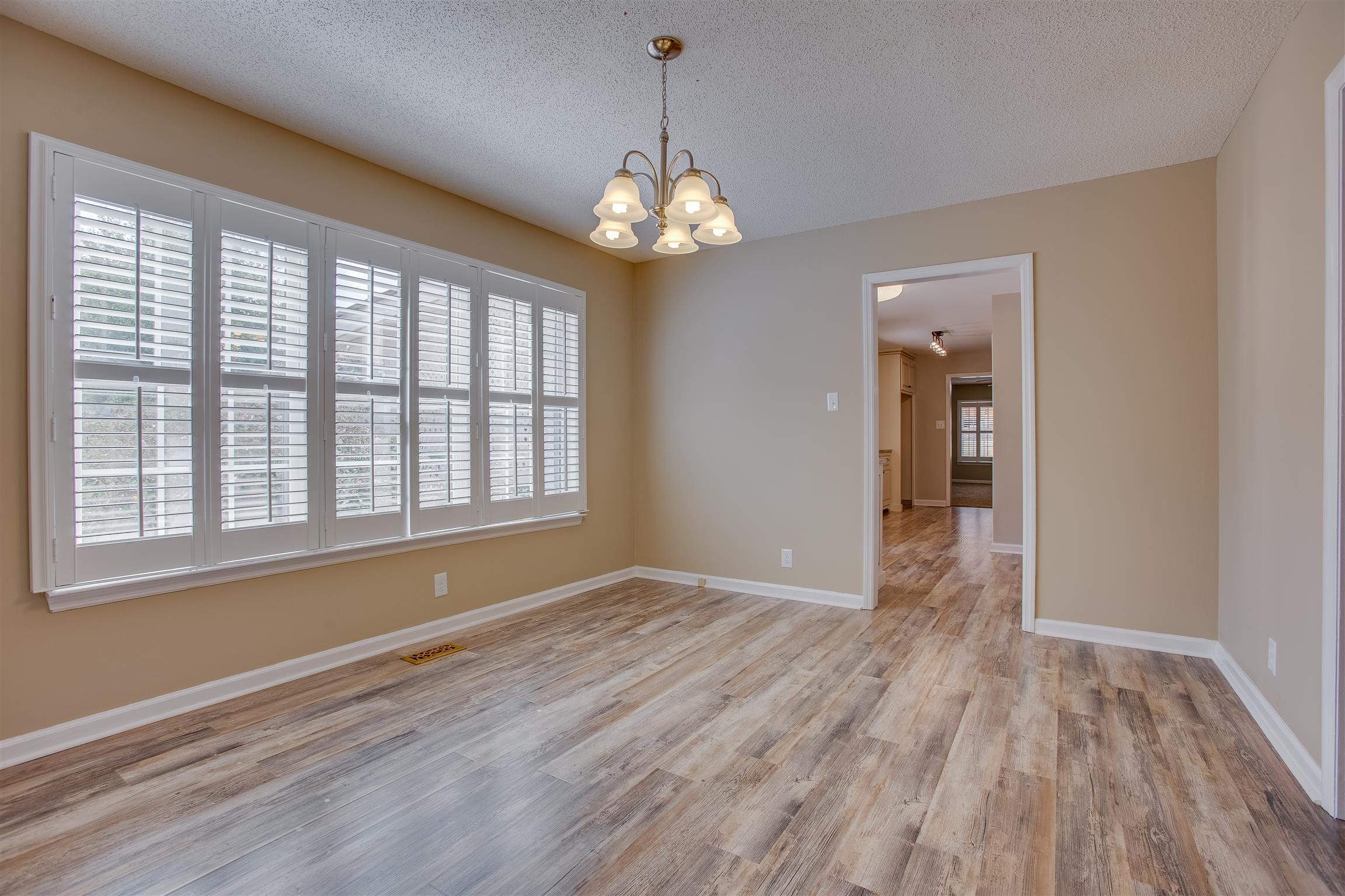 Formal Dining Room where candlelit dinner parties can really be a reality. The moonlight will trickle in these amazing windows with new custom plantation shutters
