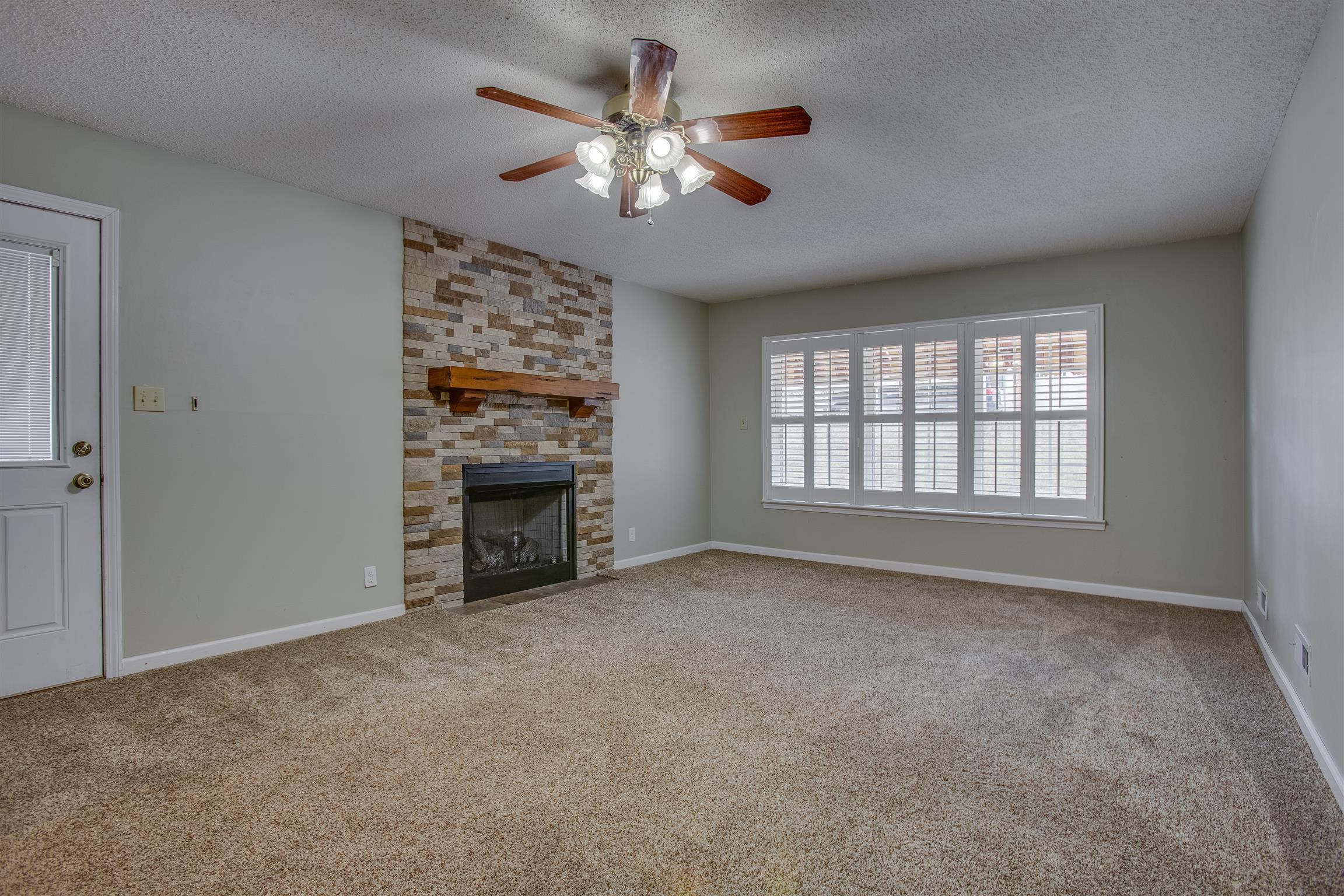 878 Tom Osborne Road Columbia, TN 38401 - Photo 10 of 26 Temps are finally dropping, so grab a fuzzy blanket and a cup of hot chocolate and cozy up by the fireplace in your family room/den!
