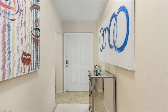 a kitchen with stainless steel appliances a refrigerator sink and microwave