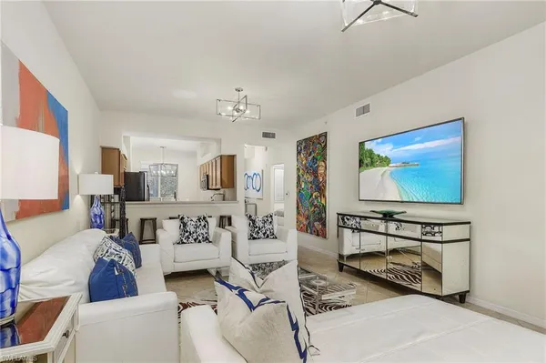 a bedroom with a bed and a night stand