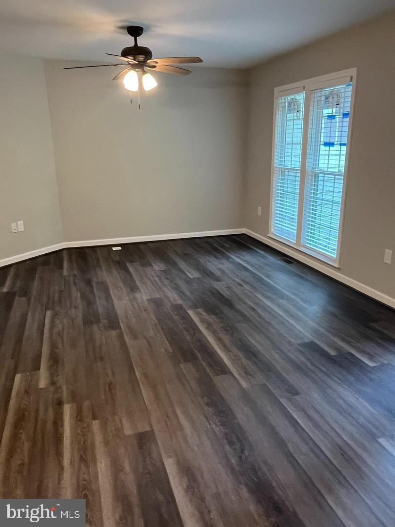 355 Crescendo Way Silver Spring, MD 20901 - Photo 2 of 23 wooden floor in an empty room with a window