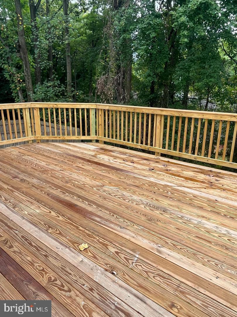 355 Crescendo Way Silver Spring, MD 20901 - Photo 4 of 23 a view of a wooden deck
