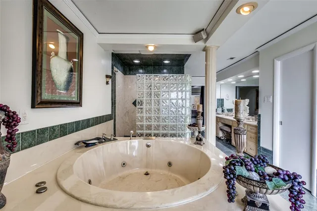 a bathroom with a bathtub and a shower