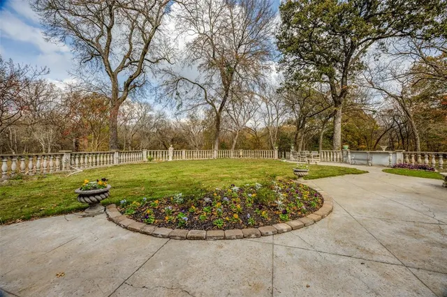 a view of a swimming pool with a garden