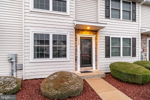 a view of a entryway door front of a house