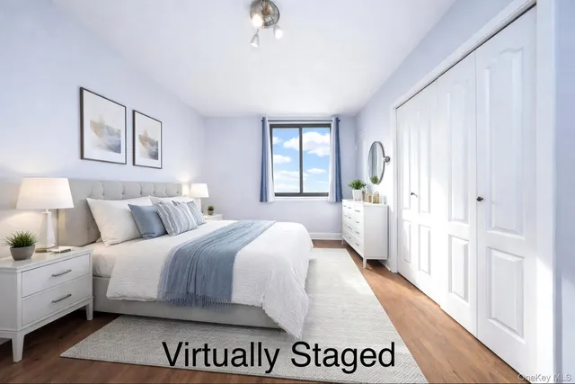 a view of a living room hardwood floor and a window