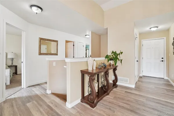 a view of entryway with wooden floor