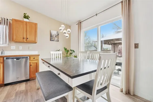 a dining room with furniture and window