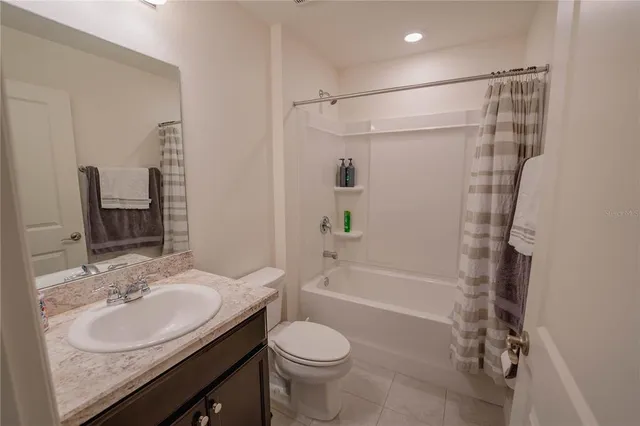 a view of workspace with furniture and a window