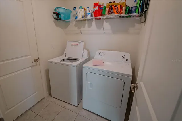a kitchen that has a lot of cabinets in it