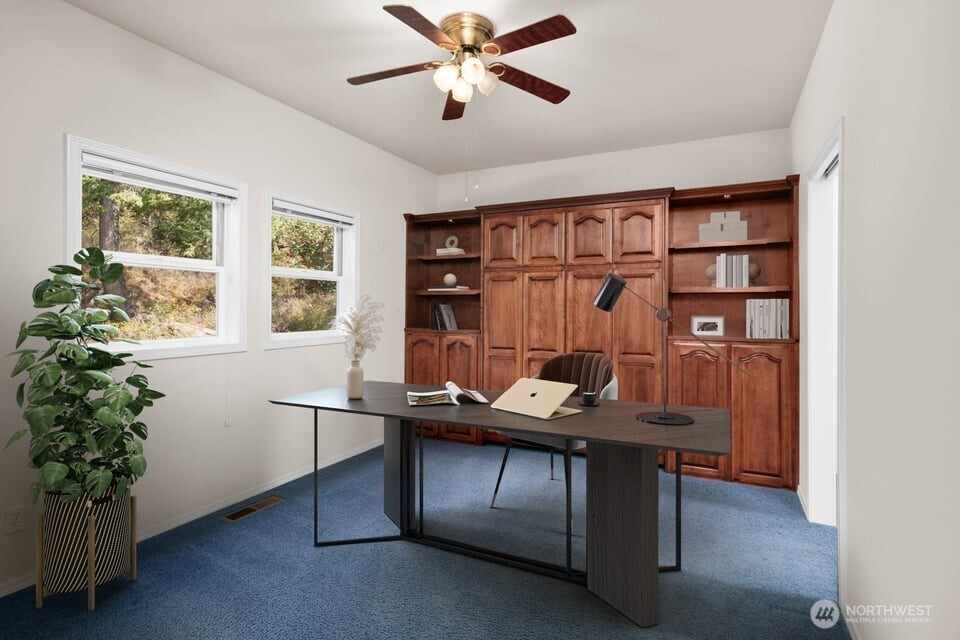 8661 Southridge Place Anacortes, WA 98221 - Photo 20 of 39 a view of a workspace with furniture and a window