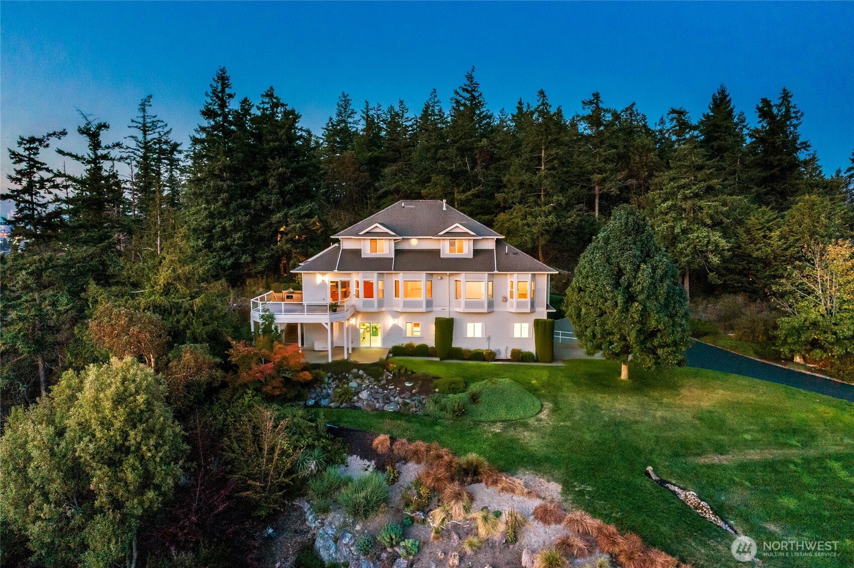8661 Southridge Place Anacortes, WA 98221 - Photo 2 of 39 a front view of a house with a yard