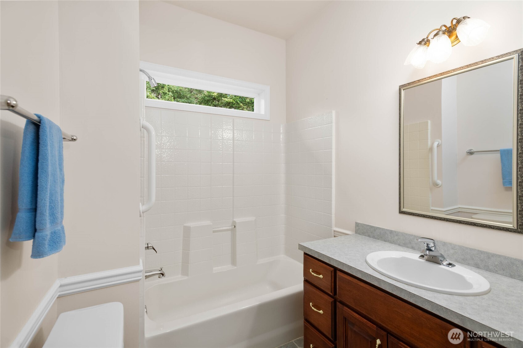 8661 Southridge Place Anacortes, WA 98221 - Photo 21 of 39 a bathroom with a sink and a mirror