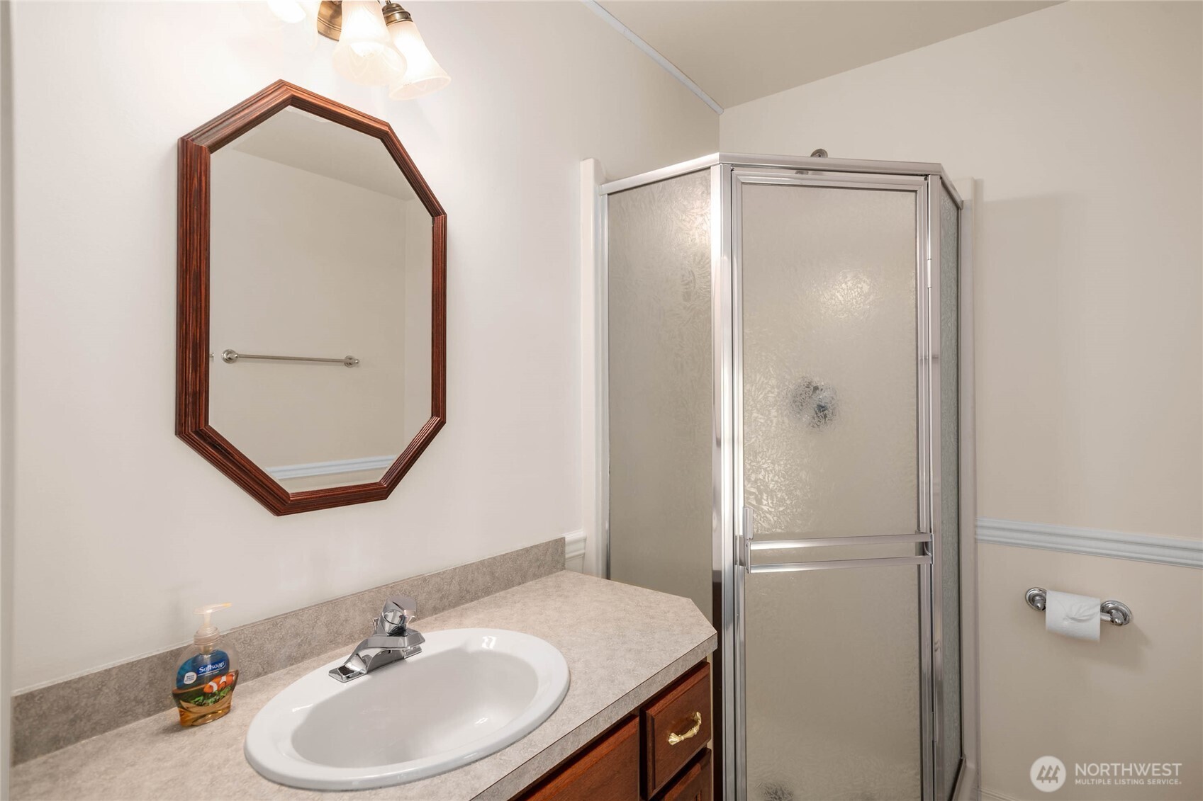 8661 Southridge Place Anacortes, WA 98221 - Photo 25 of 39 a bathroom with a sink vanity and mirror