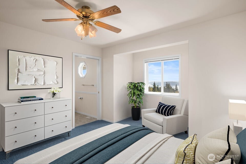 8661 Southridge Place Anacortes, WA 98221 - Photo 26 of 39 a bedroom with a bed and a couch