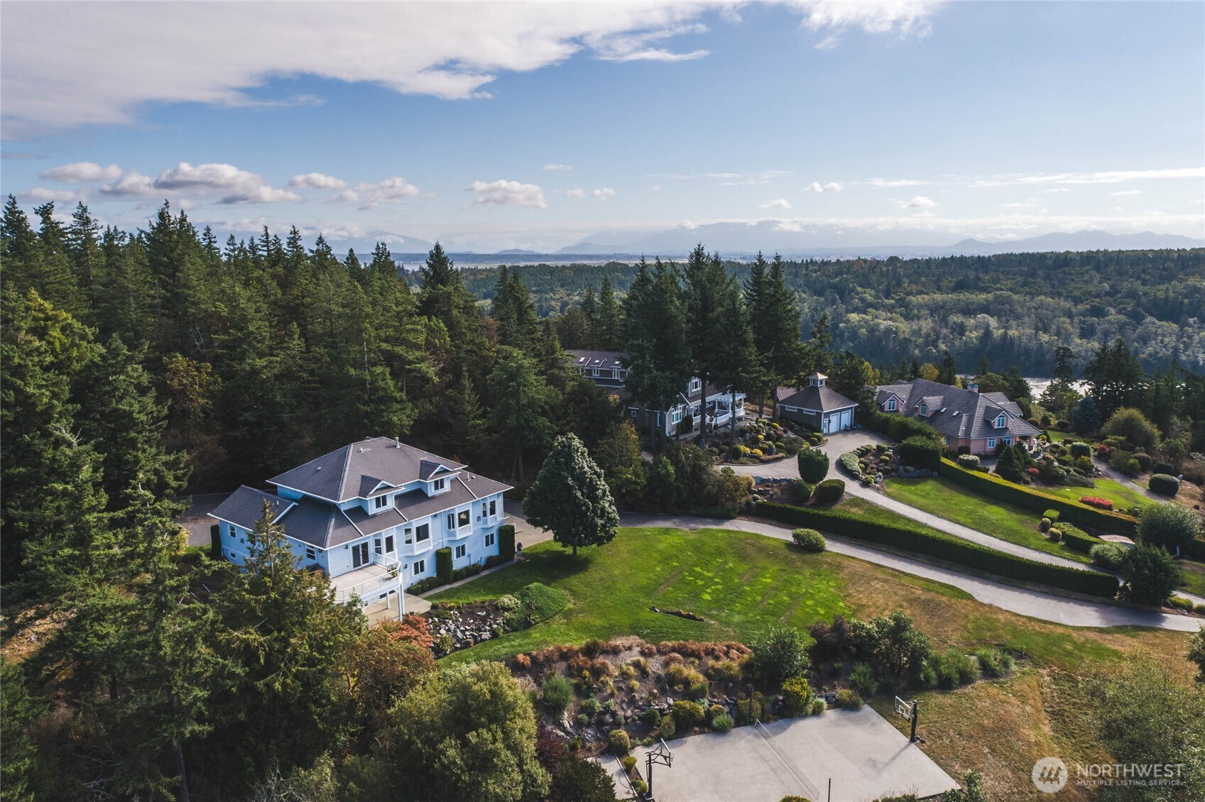 8661 Southridge Place Anacortes, WA 98221 - Photo 37 of 39 a view of a city with mountains in the background