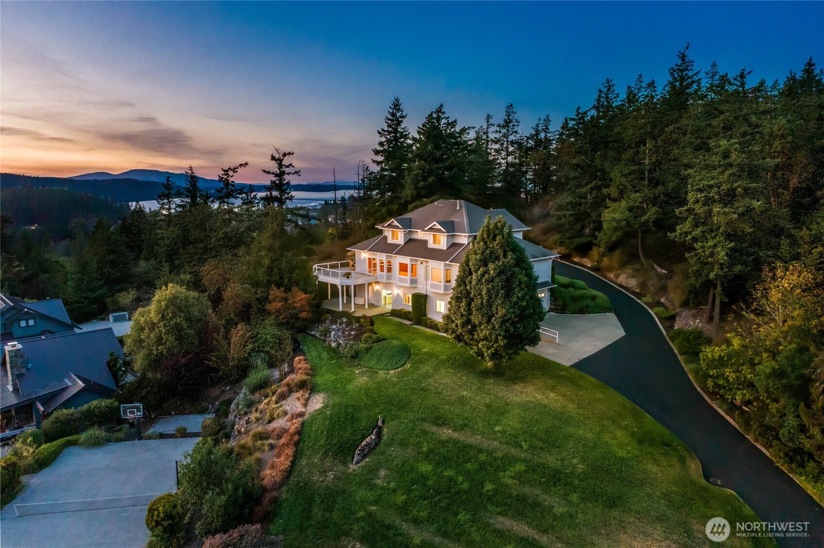 8661 Southridge Place Anacortes, WA 98221 - Photo 39 of 39 a green field with lots of trees in the background