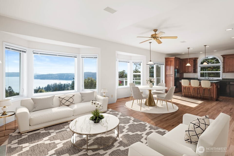 8661 Southridge Place Anacortes, WA 98221 - Photo 4 of 39 a living room with furniture kitchen view and a large window