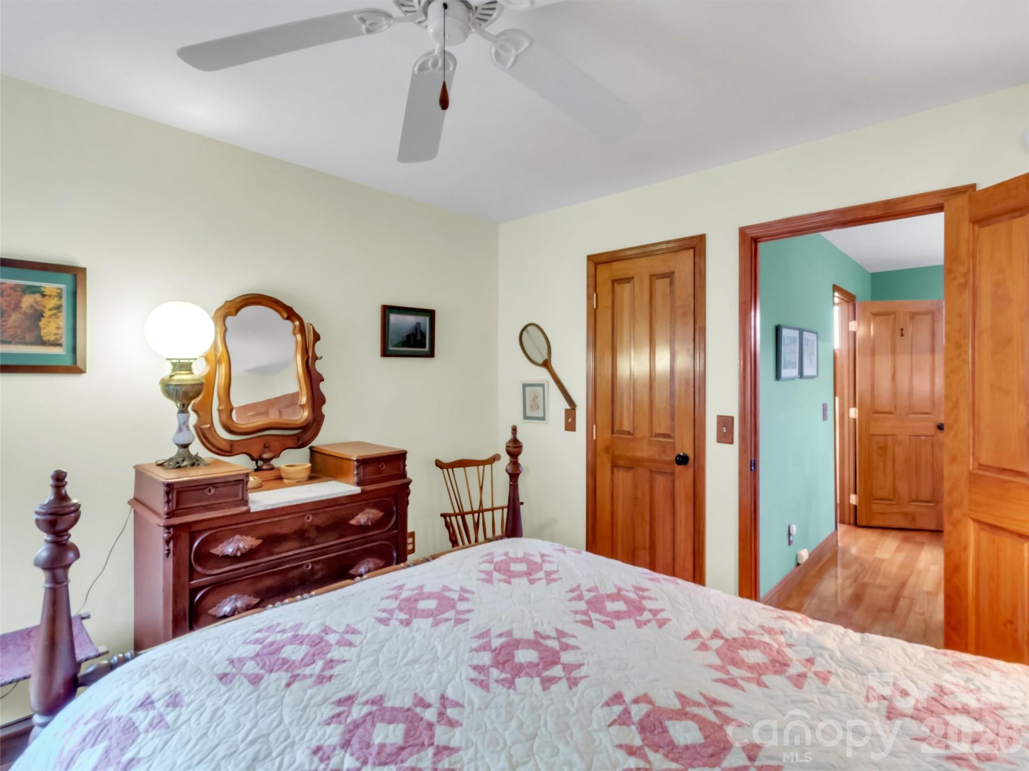 1201 Cathey Cove Road Waynesville, NC 28786 - Photo 34 of 48 a bedroom with a bed and a dresser in it
