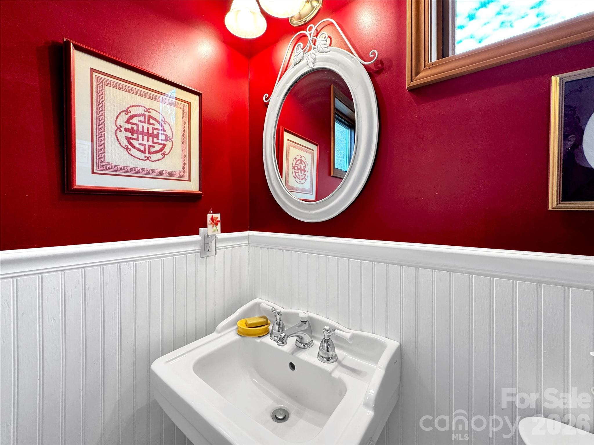 1201 Cathey Cove Road Waynesville, NC 28786 - Photo 36 of 48 a bathroom with a sink and a mirror