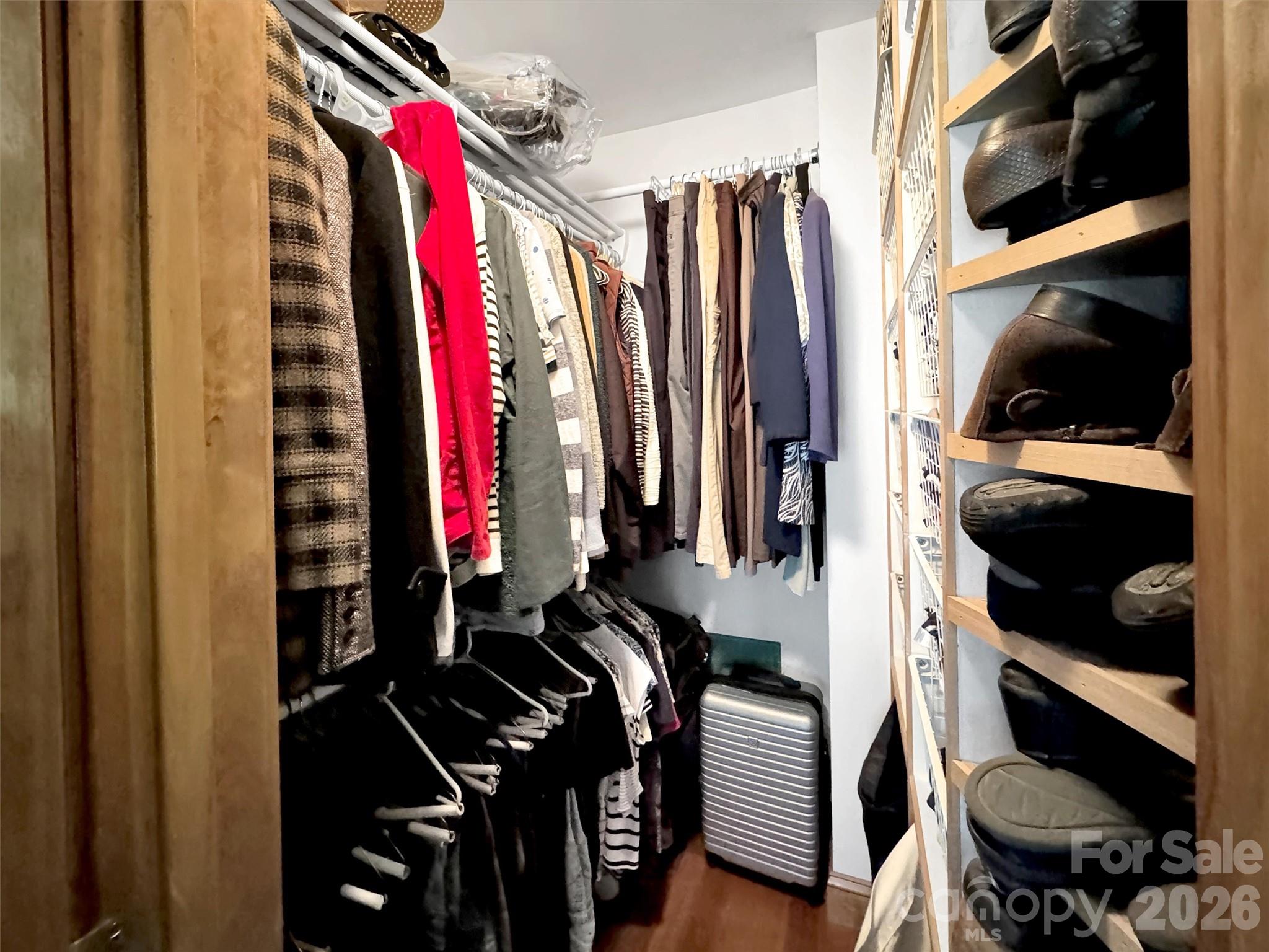 1201 Cathey Cove Road Waynesville, NC 28786 - Photo 38 of 48 a view of walk in closet with clothes and shoes