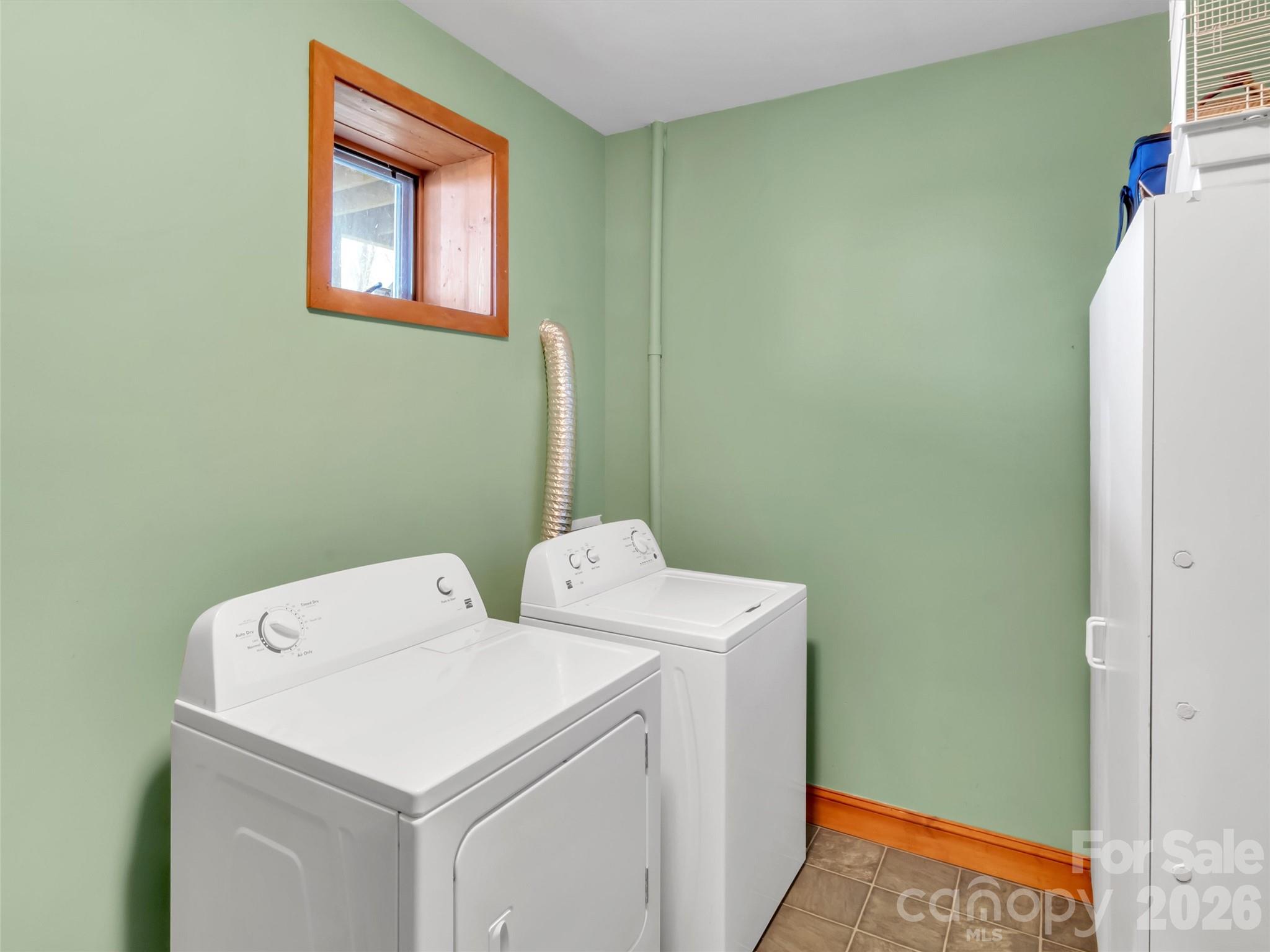 1201 Cathey Cove Road Waynesville, NC 28786 - Photo 40 of 48 a utility room with dryer and washer