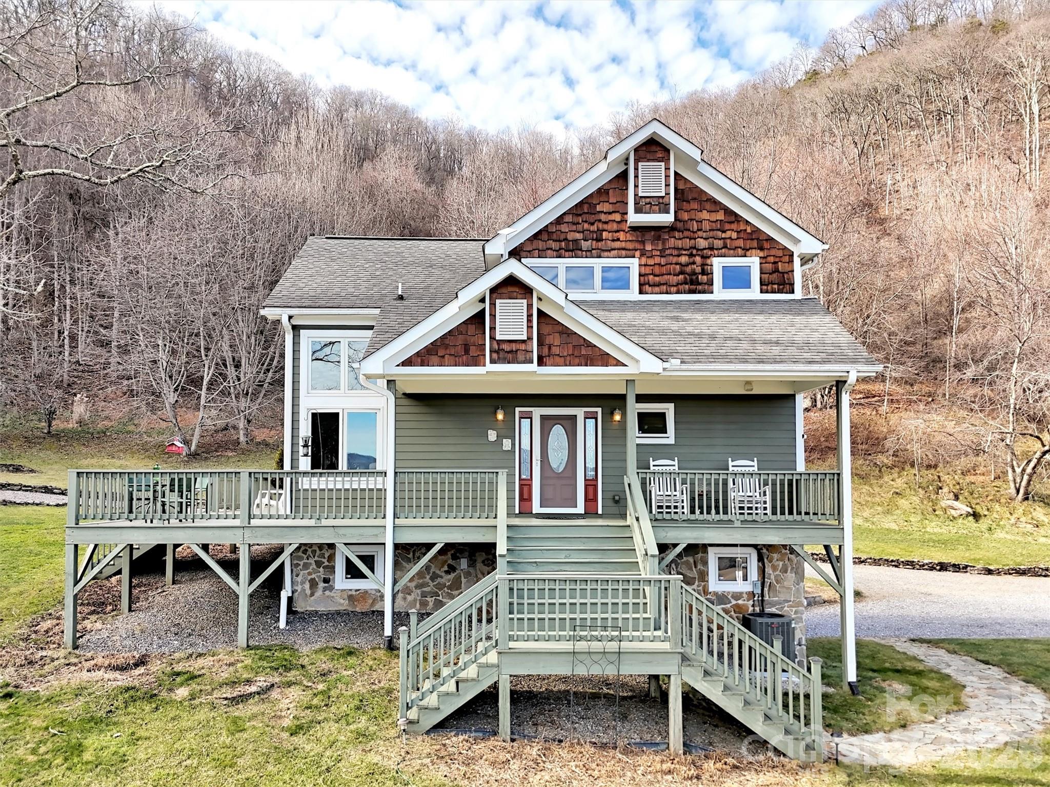 1201 Cathey Cove Road Waynesville, NC 28786 - Photo 7 of 48 a front view of a house with a yard