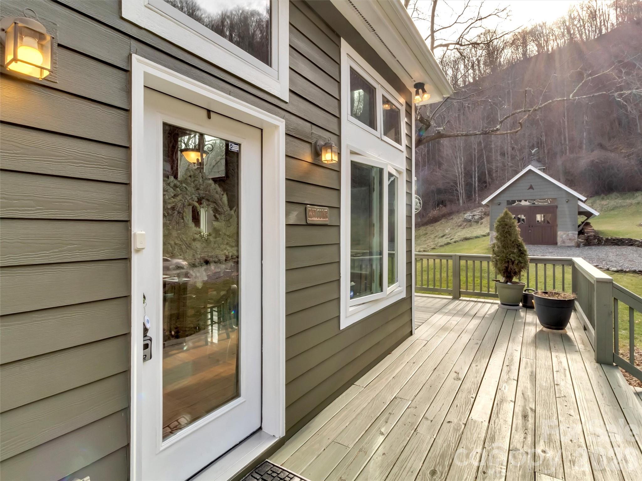 1201 Cathey Cove Road Waynesville, NC 28786 - Photo 8 of 48 a view of a house with a glass door