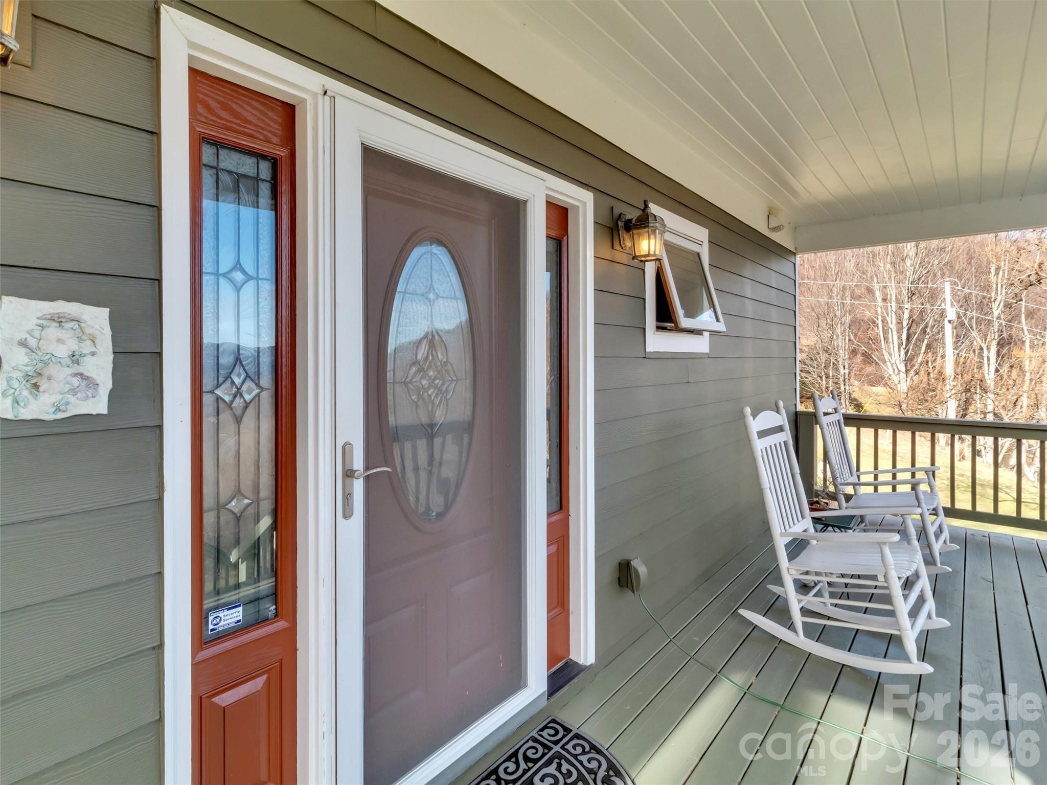 1201 Cathey Cove Road Waynesville, NC 28786 - Photo 10 of 48 a front view of a house with outdoor seating