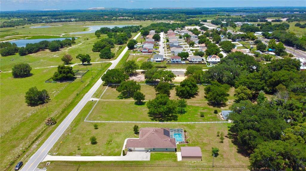 3934 Connersville Road Bartow, FL 33830 - Photo 71 of 81 an aerial view of residential houses with outdoor space and swimming pool