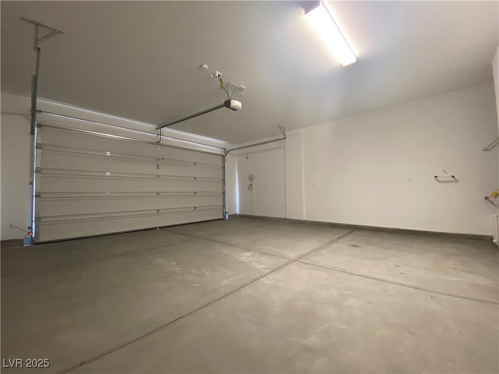 8846 Sasquatch Run Avenue Las Vegas, NV 89166 - Photo 21 of 21 Garage with baseboards