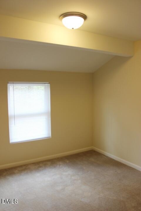 203 East Ransom Street, Unit 3D Fuquay-Varina, NC 27526 - Photo 5 of 10 an empty room with a window