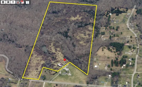 a aerial view of a house with a yard