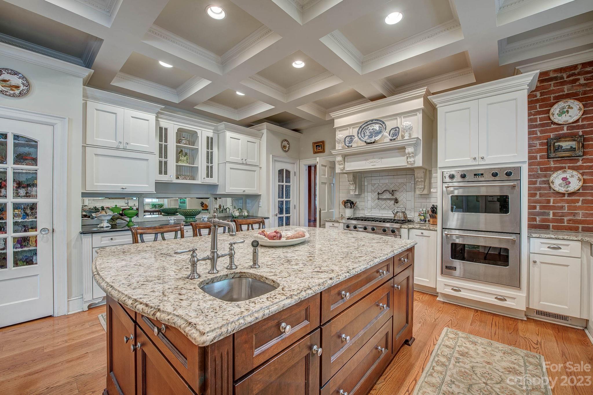 104 East Ridge Street Kings Mountain, NC 28086 - Photo 16 of 48 a kitchen with stainless steel appliances granite countertop a sink stove and cabinets
