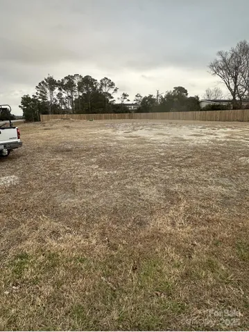 a view of lake with houses in the back