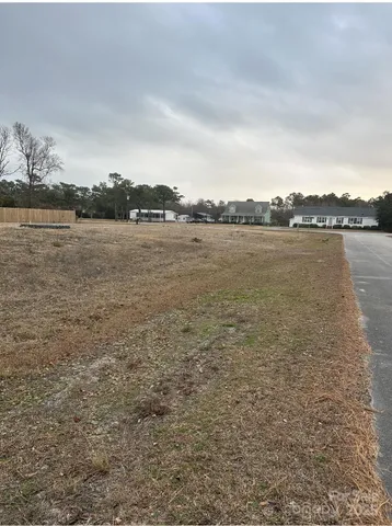 a view of boat floating on water yard