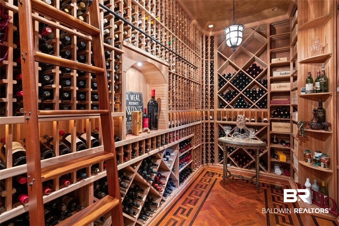 4 Chancery Court Mobile, AL 36608 - Photo 18 of 54 Wine room with parquet floors and wood walls