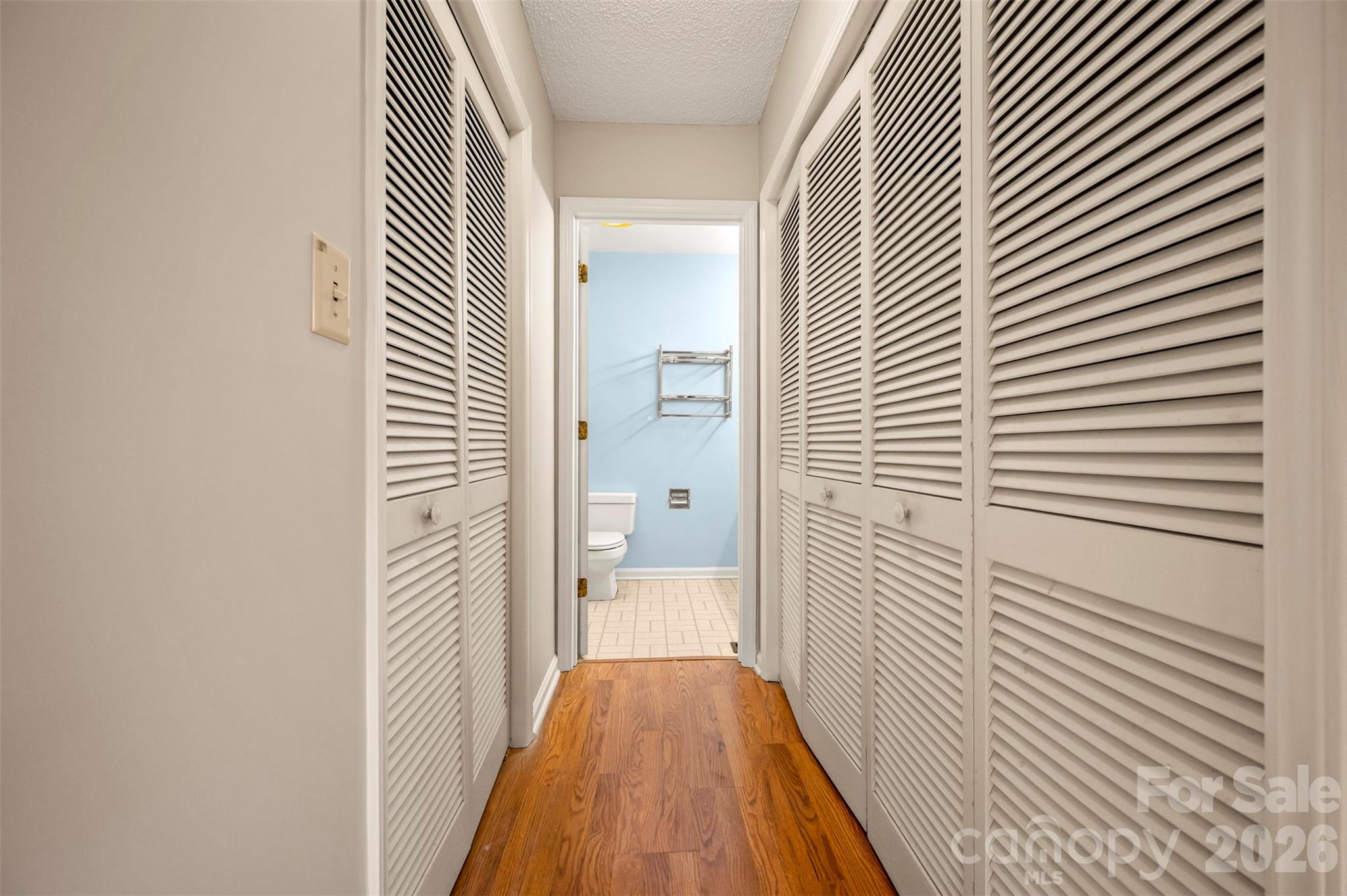 77 Chestnut Street Tryon, NC 28782 - Photo 22 of 41 a view of a hallway with wooden floor