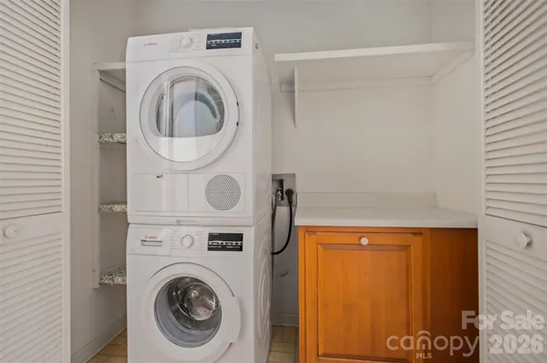 a view of a lush green hillside and a houses