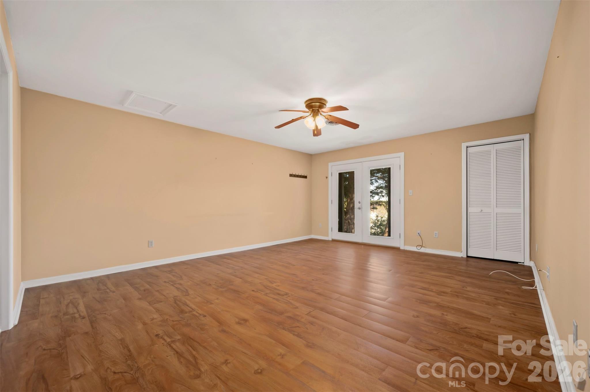 77 Chestnut Street Tryon, NC 28782 - Photo 32 of 41 a view of an empty room with window and wooden floor