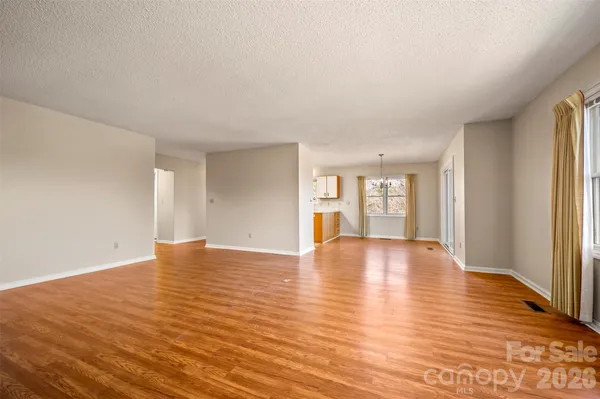 a view of balcony with wooden floor